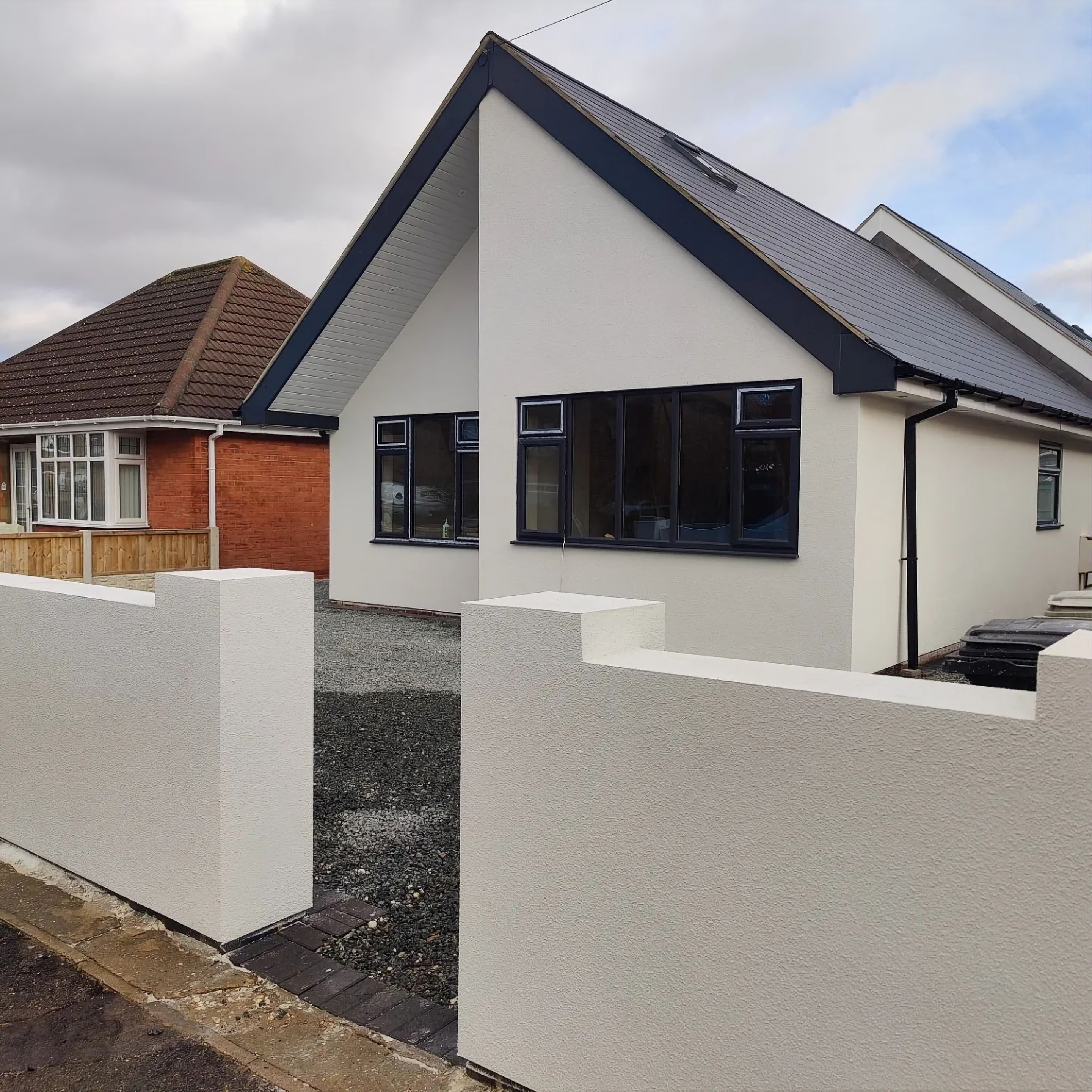 Finished white silicone-rendered bungalow and boundary wall by Rendeco